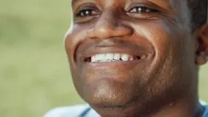https://www.pexels.com/photo/close-up-photo-of-smiling-man-7298462/ African American man smiling