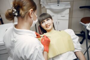 Photo by Gustavo Fring: https://www.pexels.com/photo/a-woman-on-a-dental-check-up-4971511/ - woman preparing for dental surgery