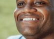 https://www.pexels.com/photo/close-up-photo-of-smiling-man-7298462/ African American man smiling